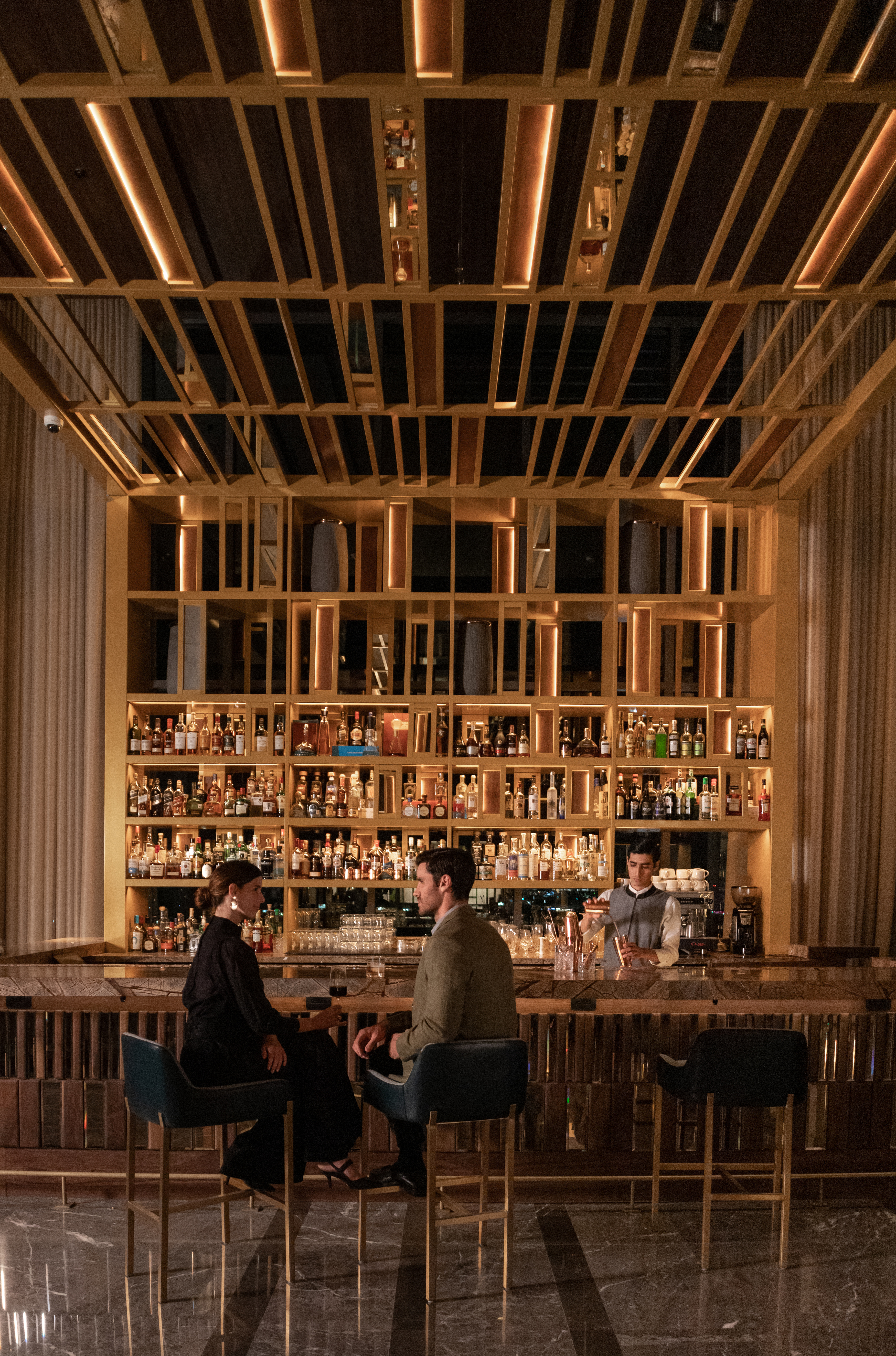 a couple sitting in a bar